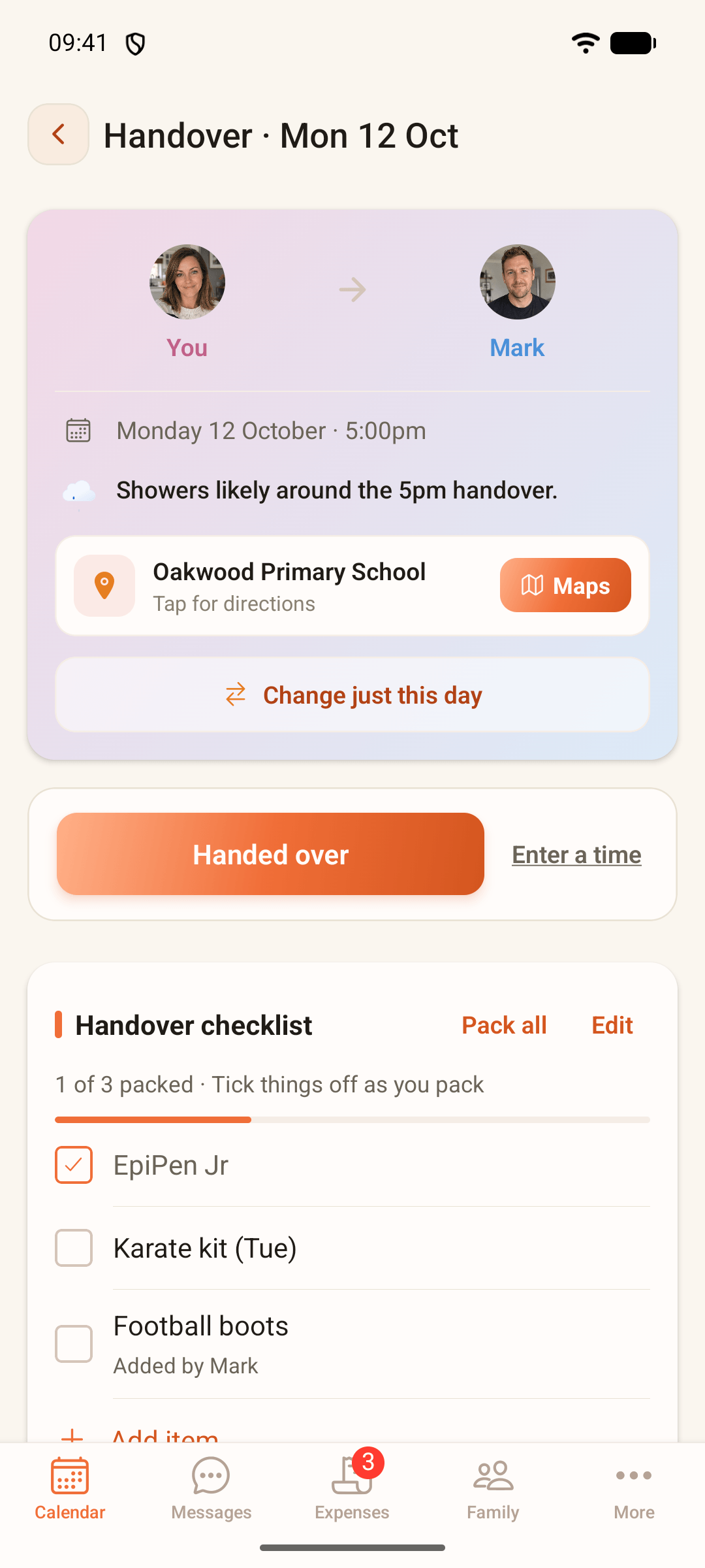 ParentGlow's handover screen for Monday 12 October at 5:00pm, from you to Mark. It says Showers likely around the 5pm handover, shows Oakwood Primary School with a Maps button and a Change just this day button, then a Handed over button beside Enter a time, and a handover checklist with 1 of 3 packed: EpiPen Jr ticked, Karate kit, and Football boots added by Mark.